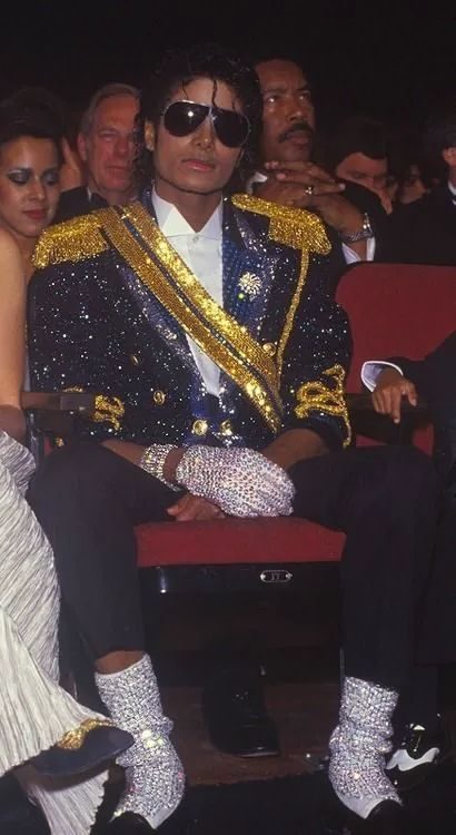 Michael Jackson in a sequinned jacket at an awards show